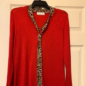 Women light red/ cheetah print sweater.